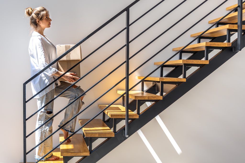 Repairing Interior Stair Treads, Risers & Landings During Philadelphia Rowhome Renovations shown in a realistic Philadelphia, PA residential construction setting.